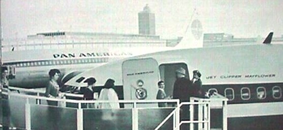 1950s Customers board  a Pan Am 707 from walkway at New York  JFK airport.